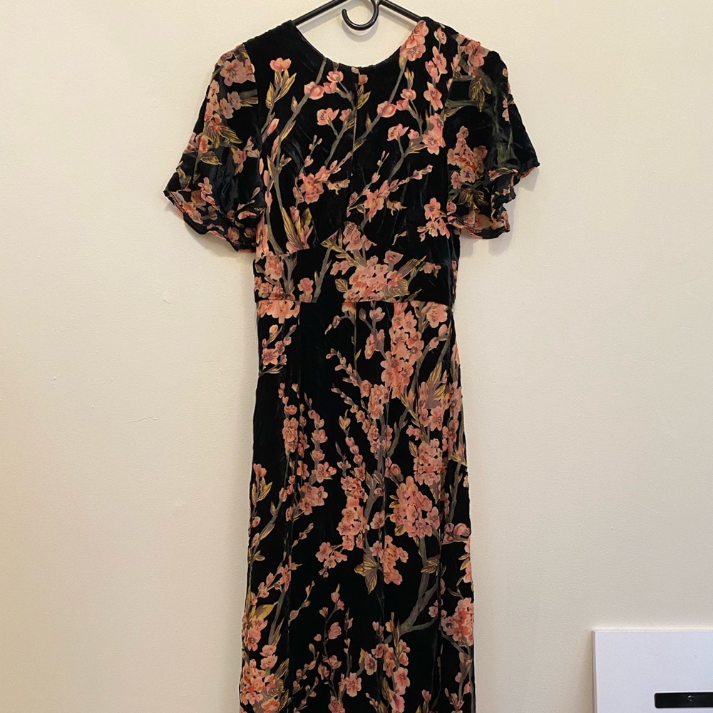 Velvet floor-length dress with floral design.